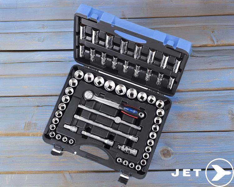 Open Jet Tools socket wrench set on wooden surface with various sizes of sockets, ratchets, and extensions in black case with blue trim