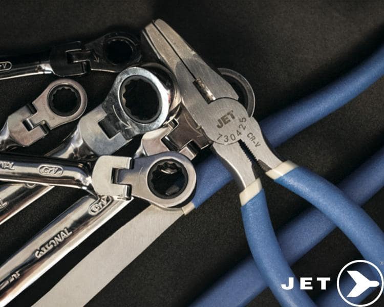 Collection of Jet Tools metal wrenches in various sizes arranged on dark surface with blue pipes and Jet Tools logo