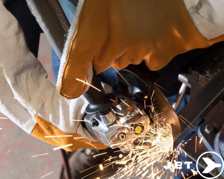 Assortment of shiny Jet Tools wrenches and sockets of various sizes on reflective blue surface, with prominent Jet Tools logo