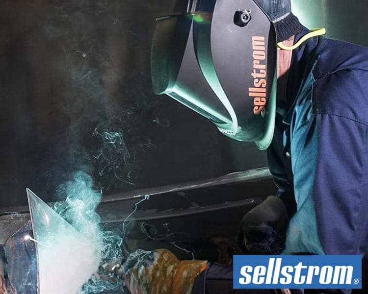 Welder using Sellstrom personal protective equipment (PPE) for maximum safety during welding in a hazardous environment.